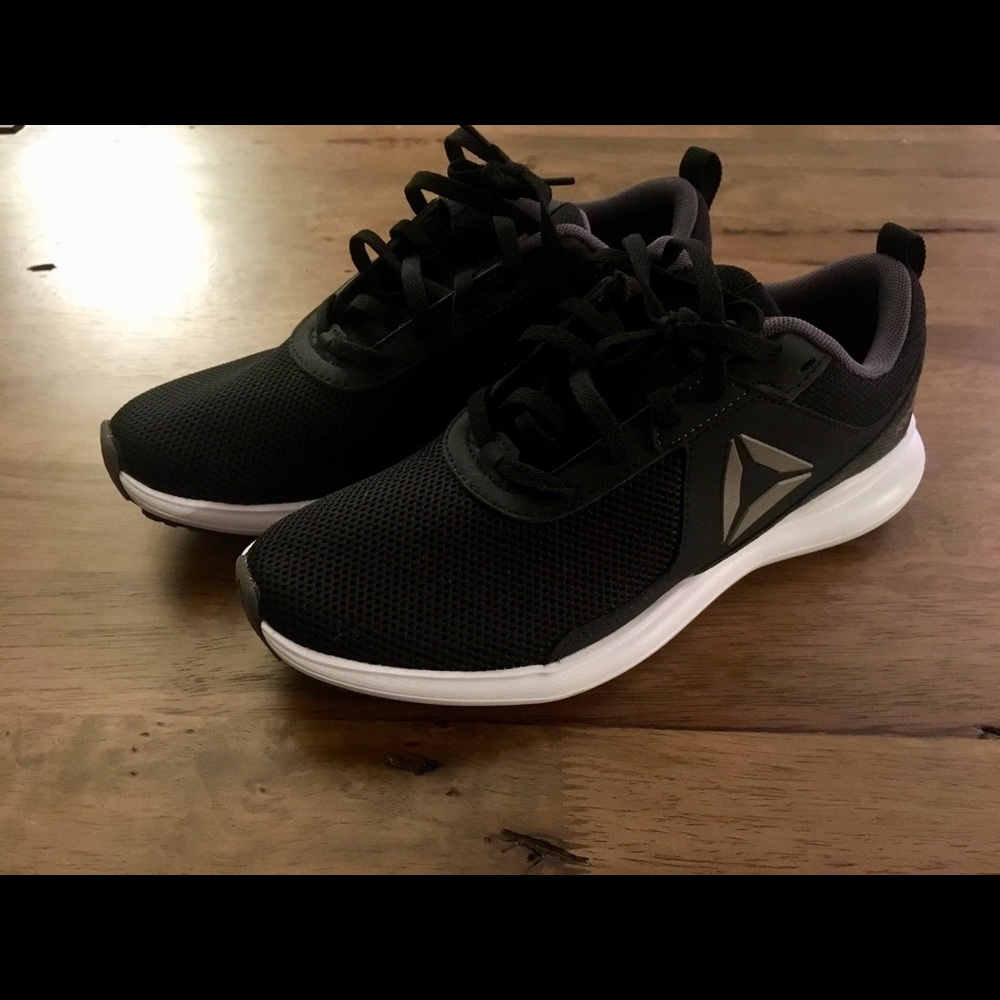 Women’s Reebok running shoes black and white.